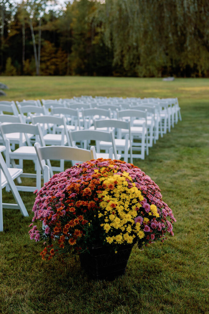 fall mums wedding ceremony decor for backyard wedding