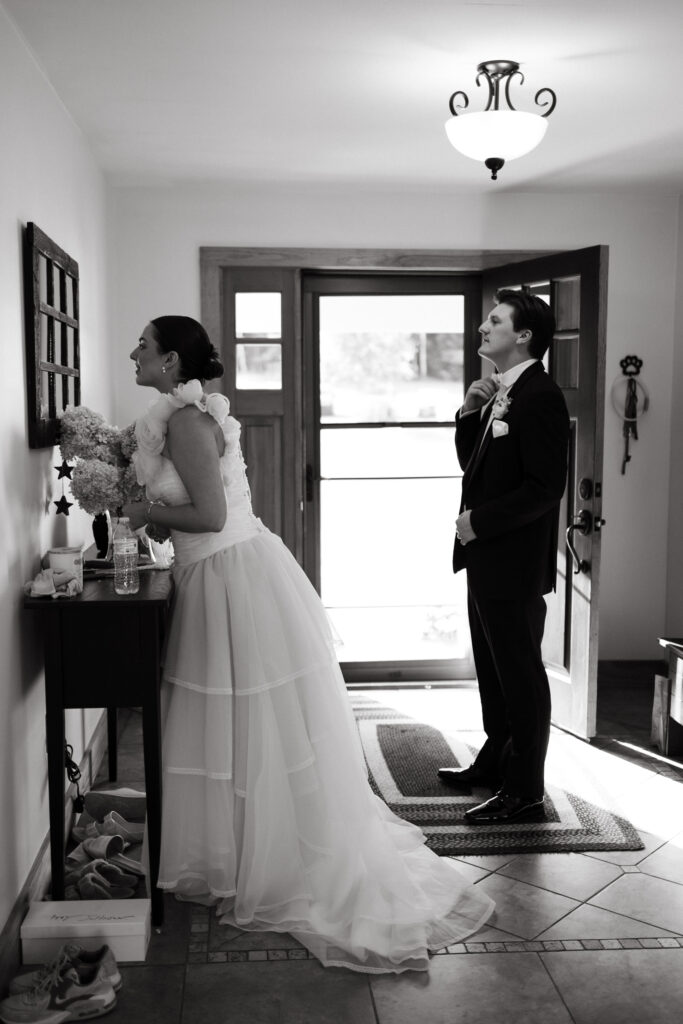 bride and groom getting ready to head outside for portraits