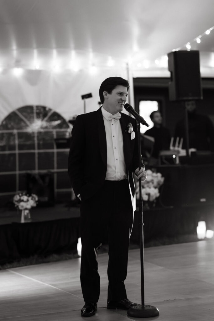 groom gives toast at wedding