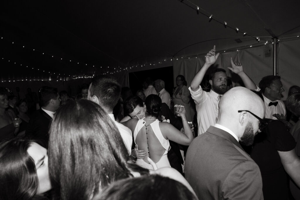 bride and groom dance in the middle of dance floor