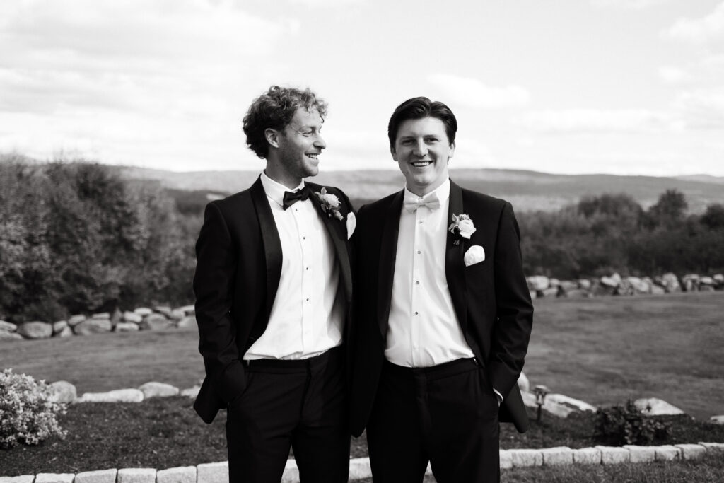 groomsman laugh during candid wedding party portraits