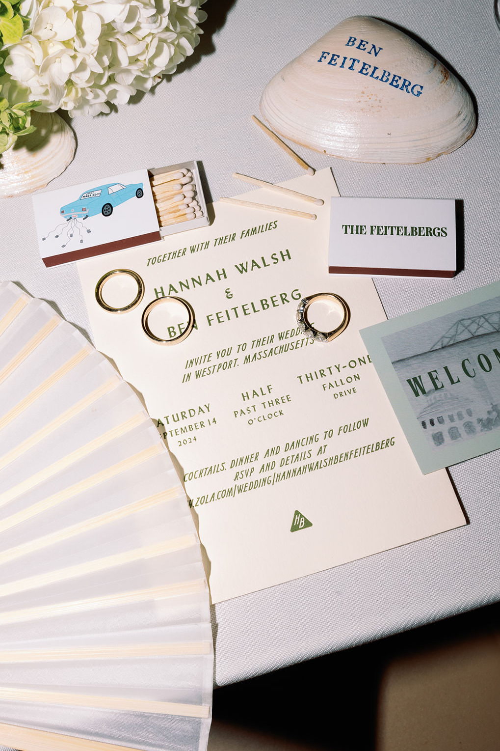 Coastal outdoor wedding party favors including shell place cards. 