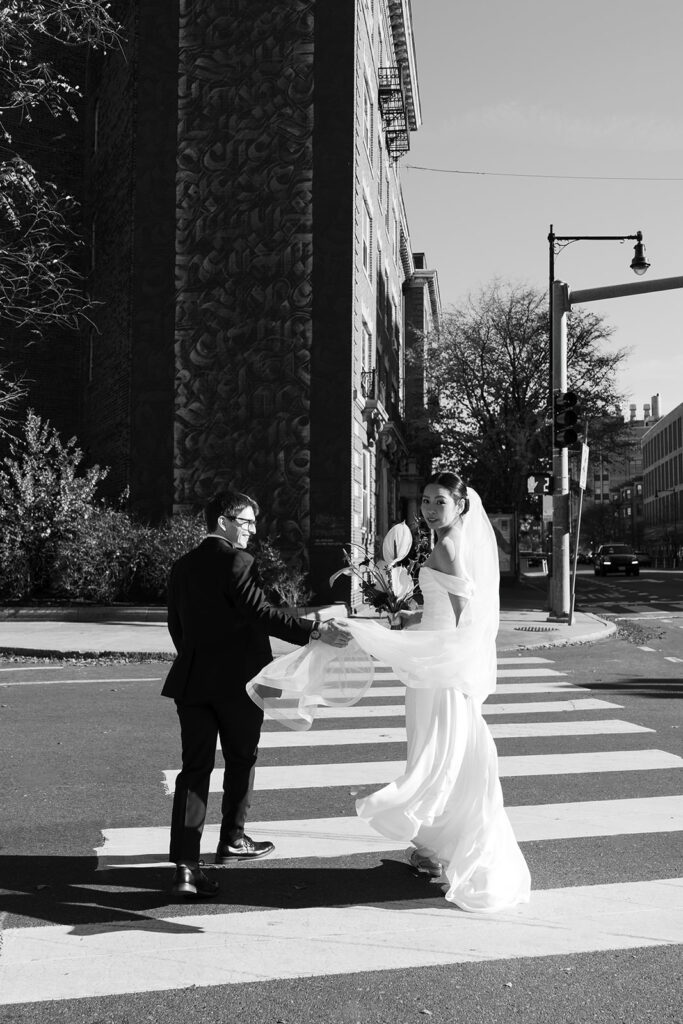 bride and groom walk through Cambridge streets in Central Square & capture editorial candids at their November restaurant wedding 