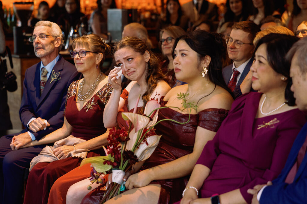 emotional family photo of family crying during grooms vows during wedding ceremony at PAGU in Cambridge MA 