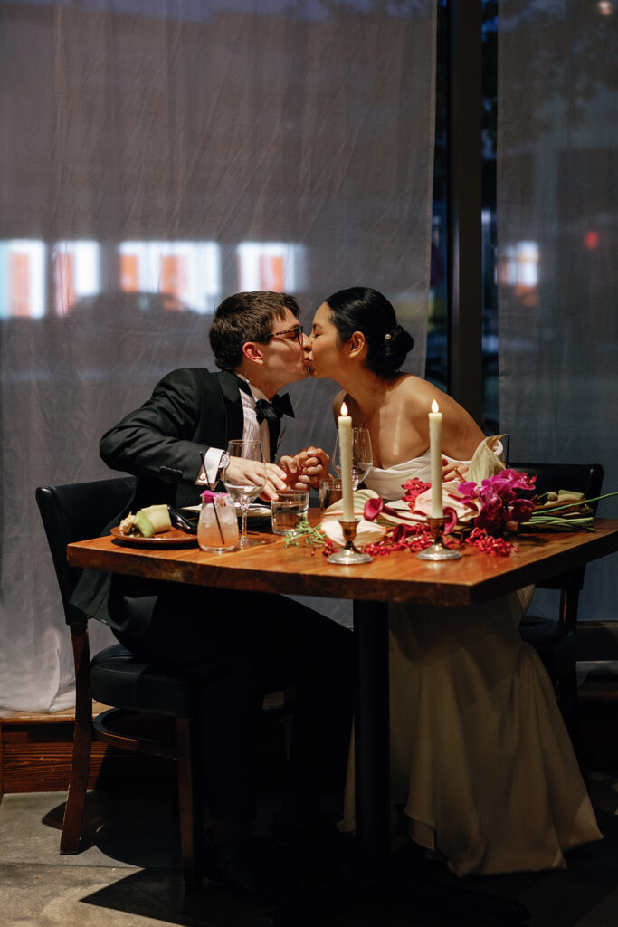 bride and groom candid kiss photo at their restaurant wedding 