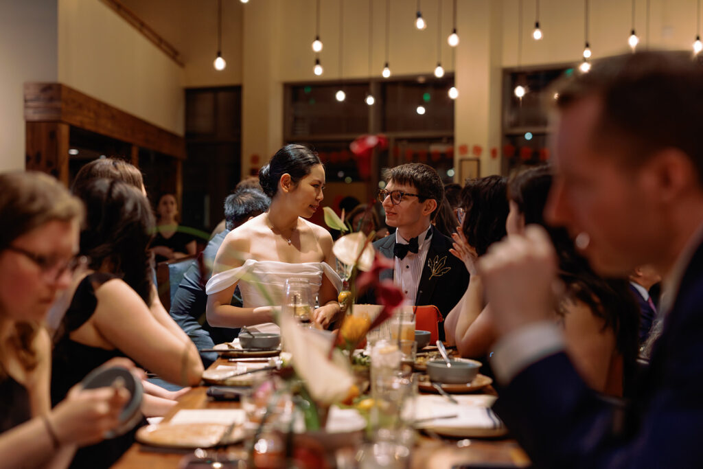 bride and groom candid at colorful restaurant wedding in Cambridge MA 