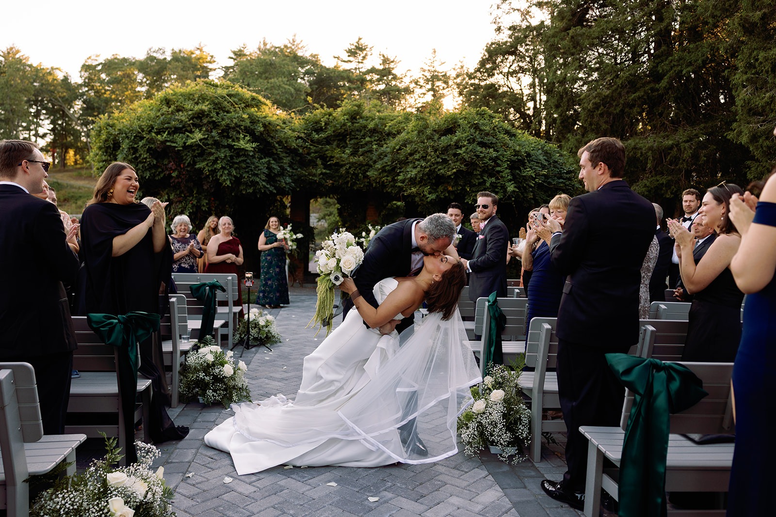 Bride and groom kissing at one of the best wedding venues in Boston.