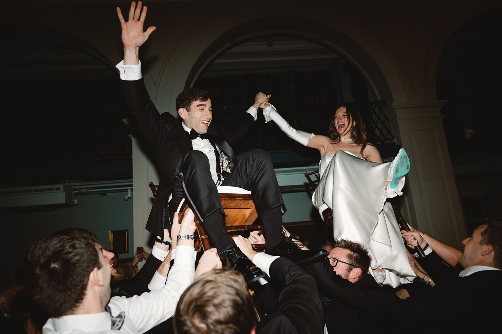 the bride and groom at a boston athenaeum events for their wedding
