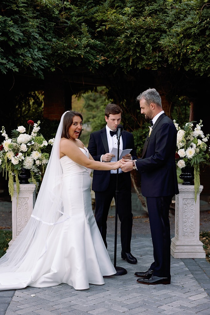 the bride and groom getting married at the mansion on turner hill