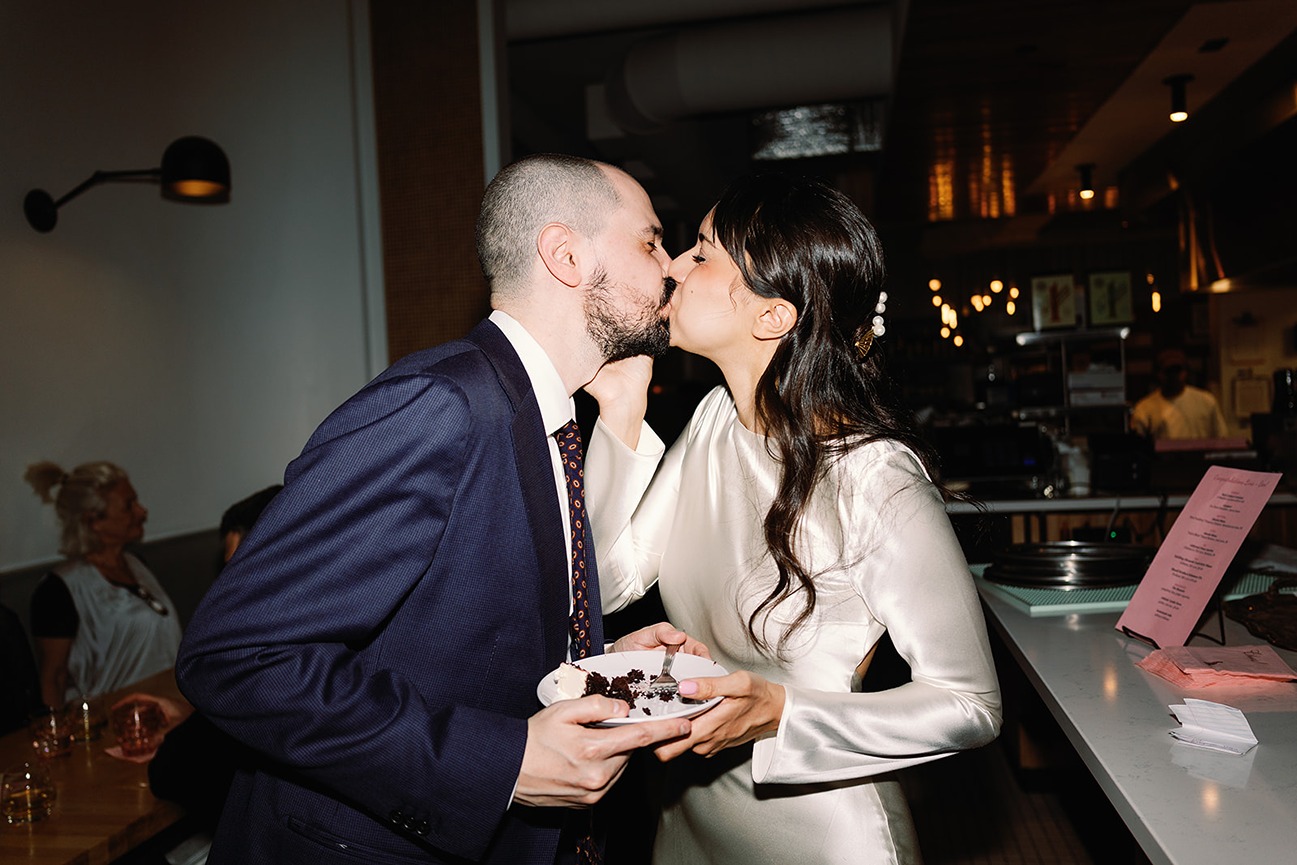 the bride and groom kissing at a wedding dinner venues in boston