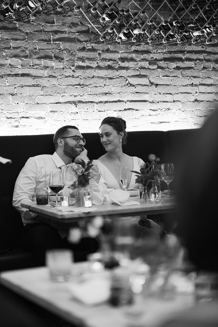 the bride lovingly looking at the groom at a restaurant wedding venue in boston