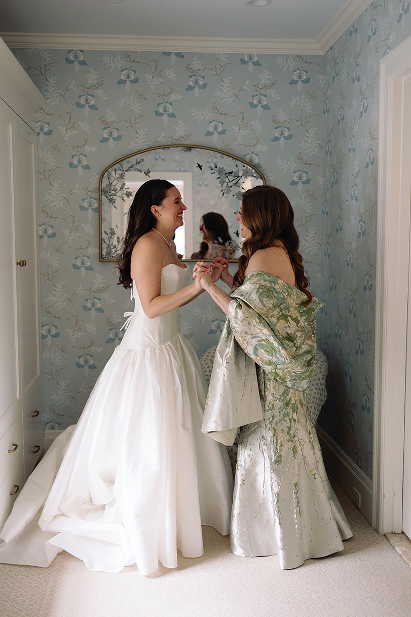 the bride with her bridesmaid at her garden of elm bank wedding