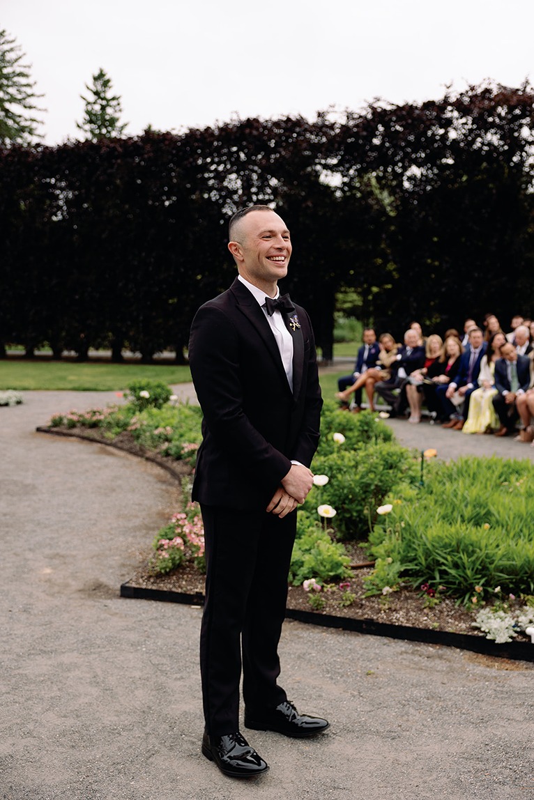 the groom at his garden at elm bank wedding