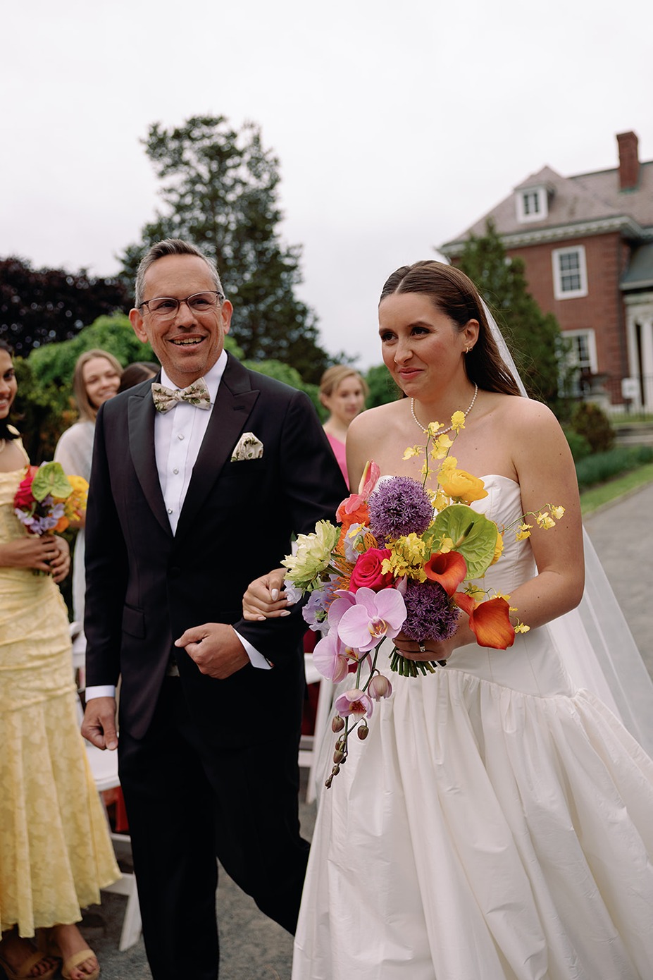 the bride walking down the aisle at her garden at elm bank wedding
