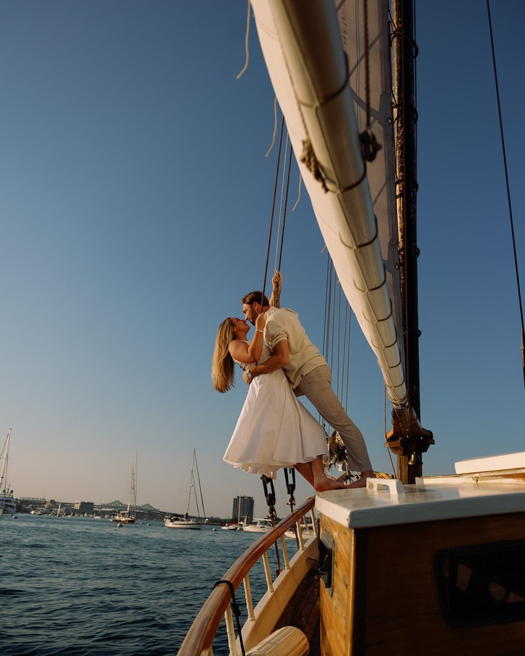 boston harbor sailboat engagement session photo